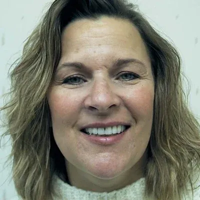 A patient of Dr. Bjorklund showing off her new smile.