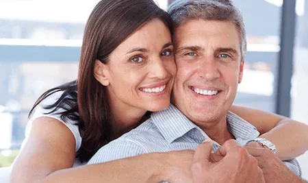A couple smiling — the practice's own image for general and family dentistry in Wayzata.